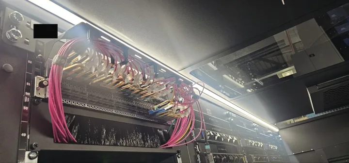 After (Solution): Cables are fanned and dressed into neat, vertical bundles. Ports are visible, and labels are clearly displayed, allowing instant identification.