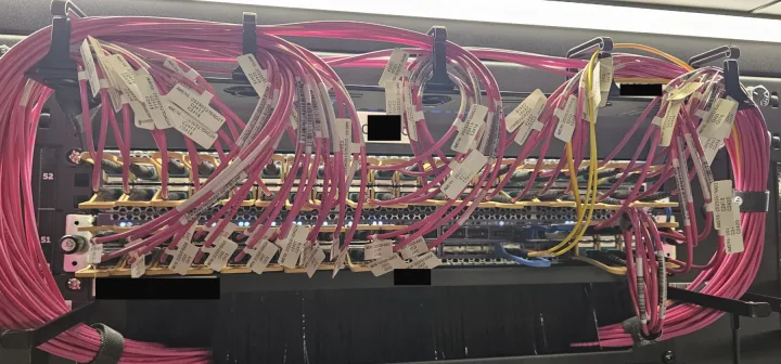 Before (Problem): Massive cable spaghetti obscures ports. Labels are tangled and illegible, making identification impossible without tracing.